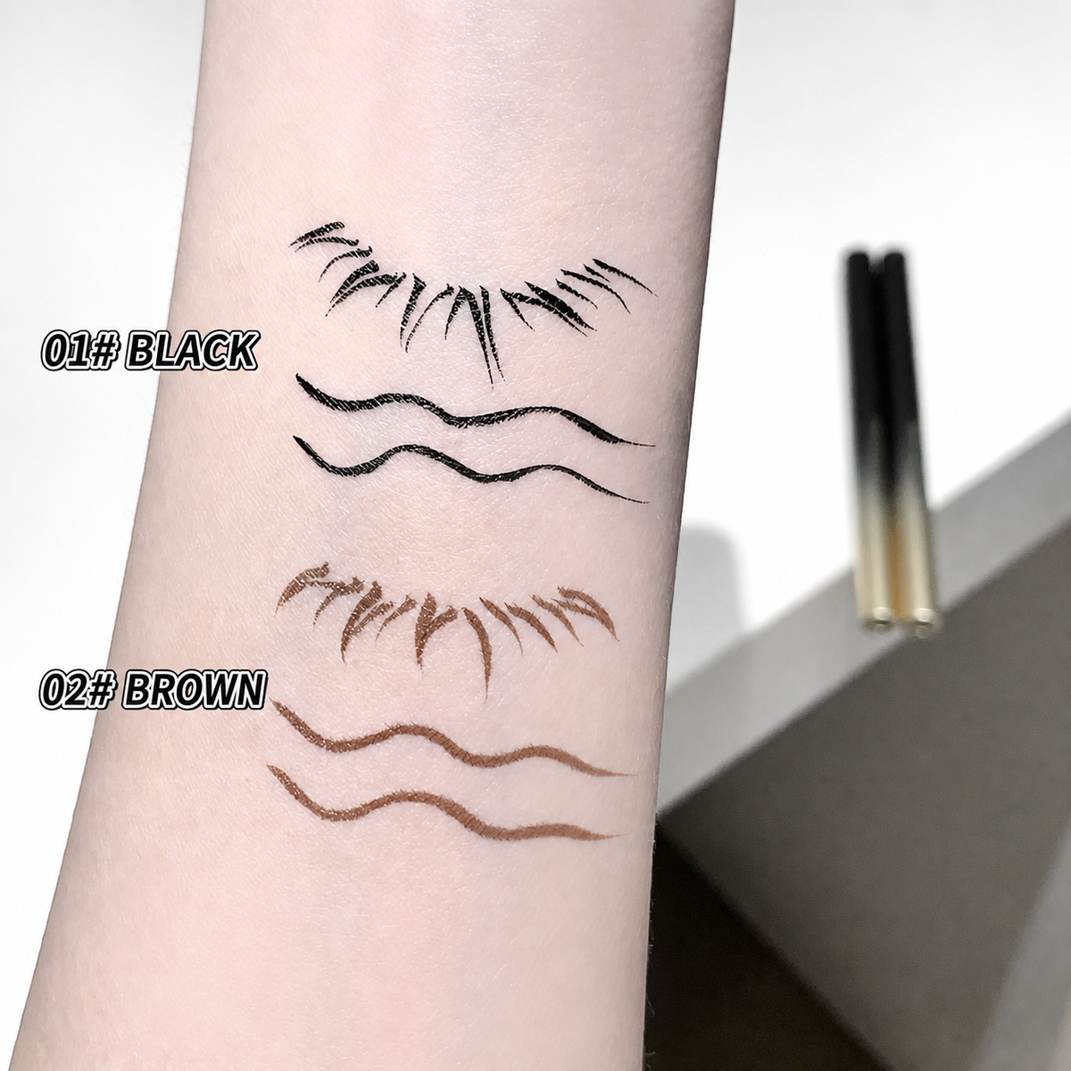 A close-up of a forearm showing two sets of temporary tattoo or ink line designs labeled 01# BLACK and 02# BROWN. The top set resembles eyelashes, and the bottom set resembles wavy eyebrows.
