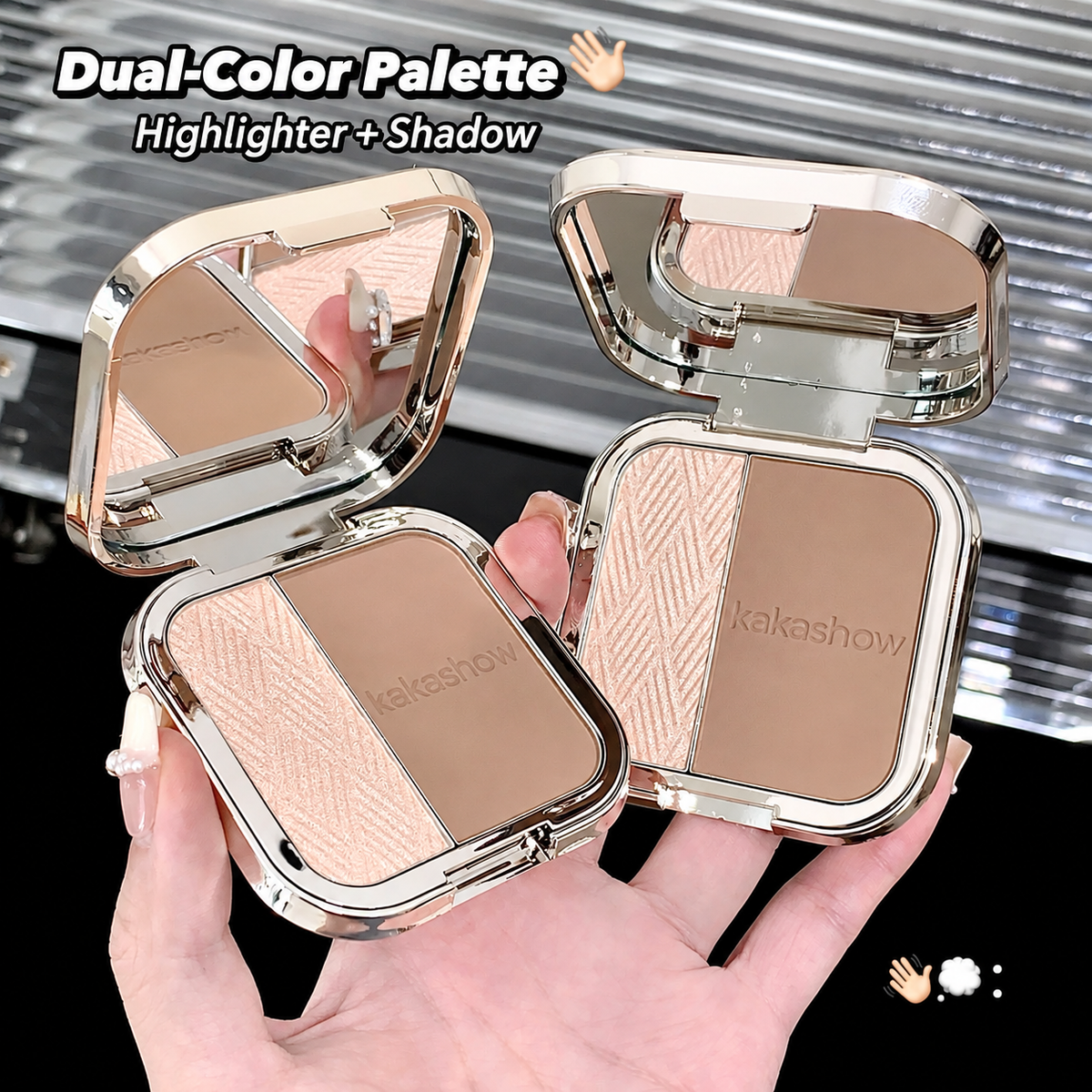 A hand holding two open compact makeup palettes with mirrored lids and two-toned highlighter/shadow powders. The text at the top reads 'Dual-Color Palette Highlighter + Shadow' and the brand name 'kakashow' is visible on the powder pans.