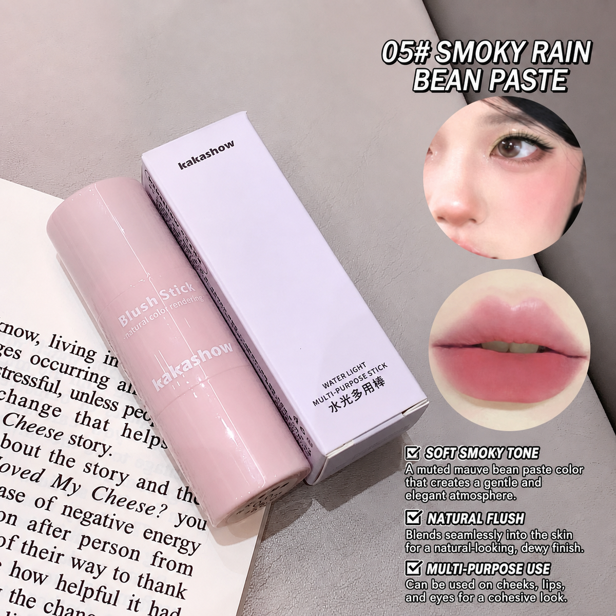Kakashow blush stick in shade 05 'Smoky Rain Bean Paste' shown with its white box, placed on an open book next to a close-up of a model's face and lips showing the pink blush application.