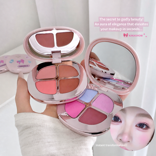 A hand holds two round pink makeup palettes with mirrors and four-color face powders. One palette shows coral and nude shades, and the other shows pink, lavender, and mauve shades.